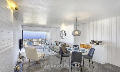 Fully renovated modern luxury apartment for sale in the marina of Puerto Banus with panoramic views over the port and the sea, Marbella. Bottom price! 12747