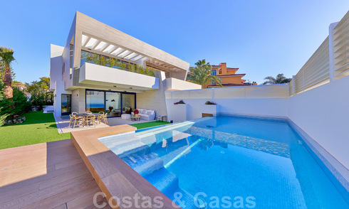 Modern, semi-detached villas for sale at 300 meters from the beach in Puerto Banus, Marbella 31677