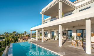 Exclusive designer villa with panoramic sea views for sale in the a five-star golf resort in Marbella - Benahavis 74778 