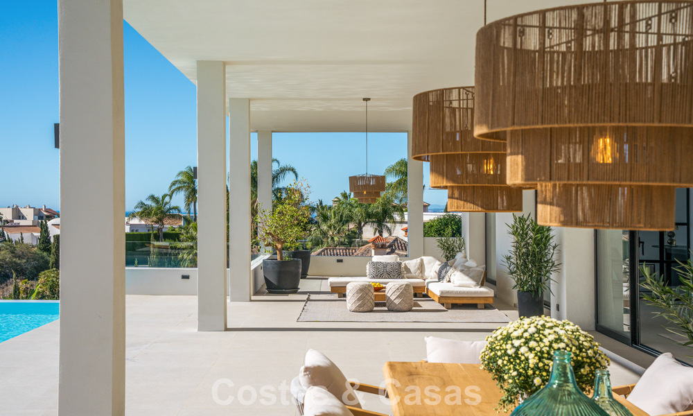 Exclusive designer villa with panoramic sea views for sale in the a five-star golf resort in Marbella - Benahavis 74792