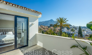 Stylishly renovated luxury villa with sea views for sale in Nueva Andalucia's golf valley, Marbella 67745 