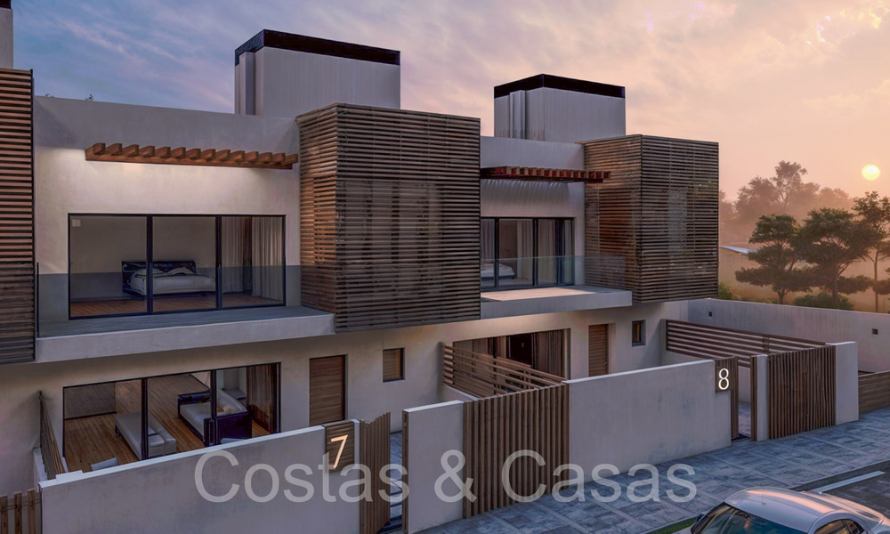 New development of 8 townhouses for sale adjacent to the golf course in Estepona 70557