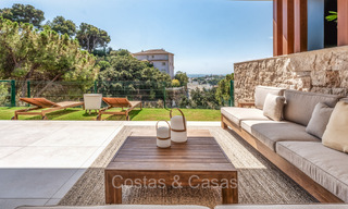 Move-in ready, modern, elegant garden apartment with private garden and sea views for sale in Marbella East 72732 