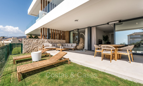 Move-in ready, modern, elegant garden apartment with private garden and sea views for sale in Marbella East 72733