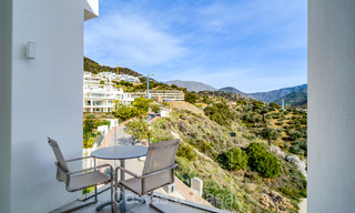 Move-in ready, contemporary apartment with sea views for sale in a gated community located in the hills of Marbella 73470 