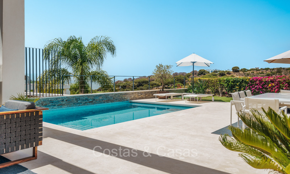 Move-in ready modern semi-detached villa with sea views for sale, on the golf course in East Marbella 74198